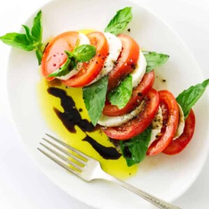 Overhead view of Italian Caprese Salad, oil/vinegar dressing