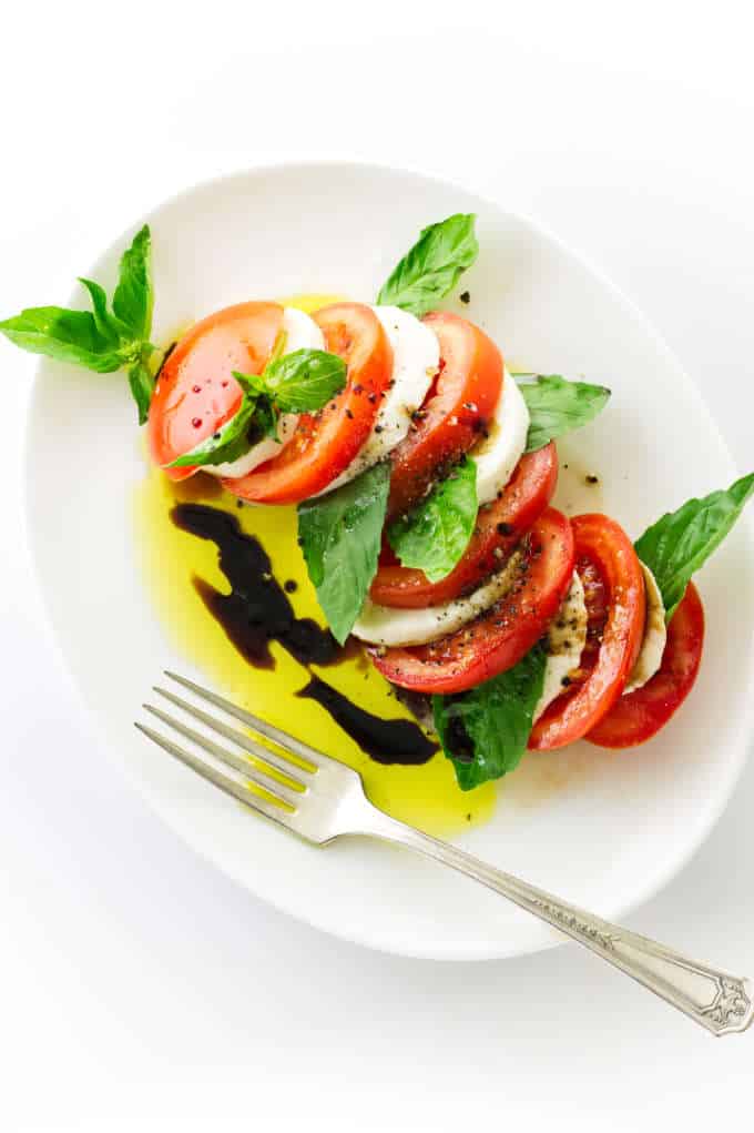 Overhead view of Italian Caprese Salad, oil/vinegar dressing