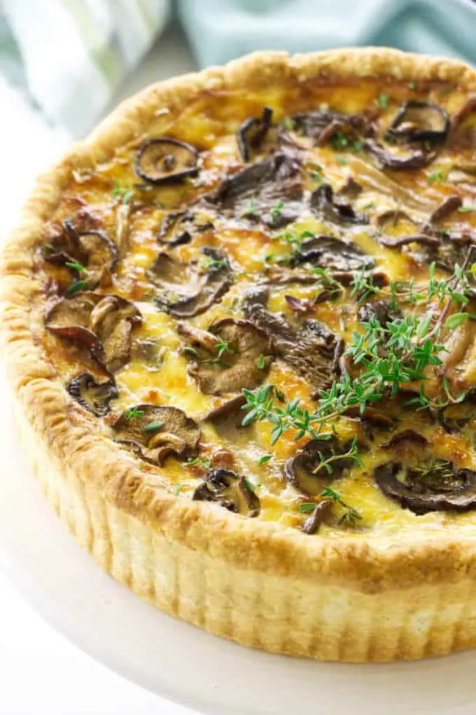 Overhead view of Mushroom quiche, towel in background
