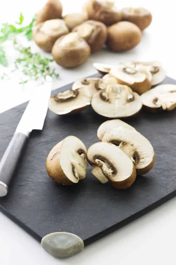 Mushrooms, cutting board, knife