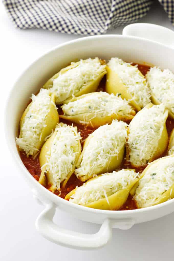 Casserole dish of stuffed pasta shells ready to bake