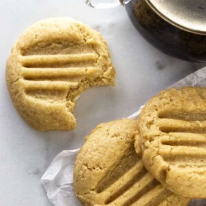 Three honey tahini cookies and a cup of coffee.