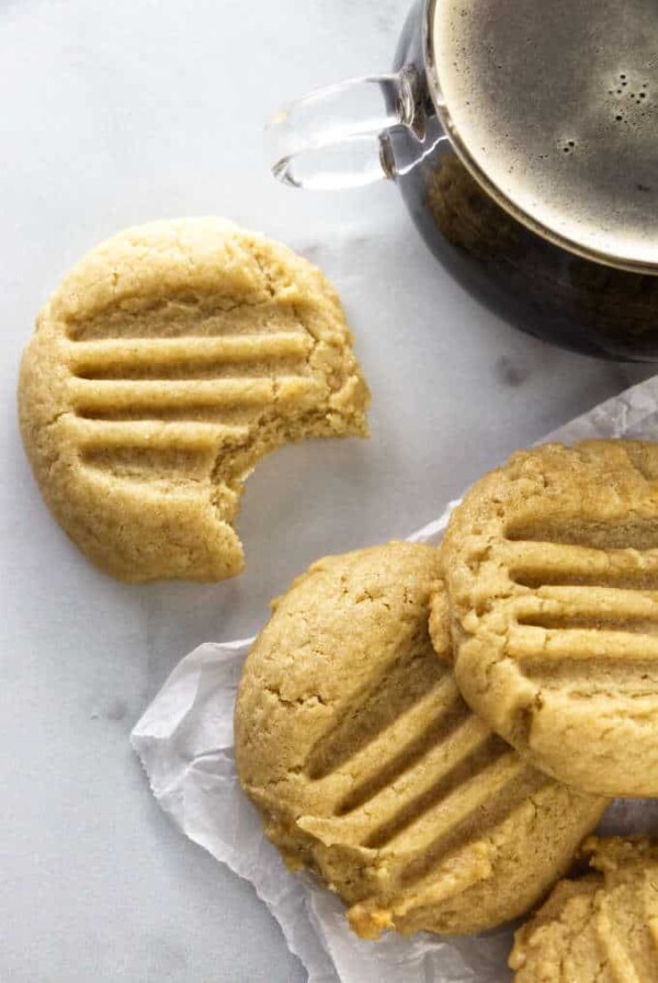 Three honey tahini cookies and a cup of coffee.