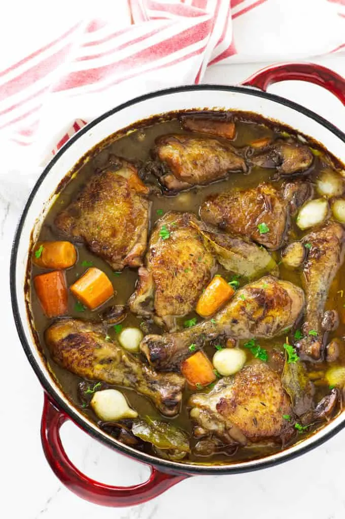 Overhead view of a braiser with coq au vin