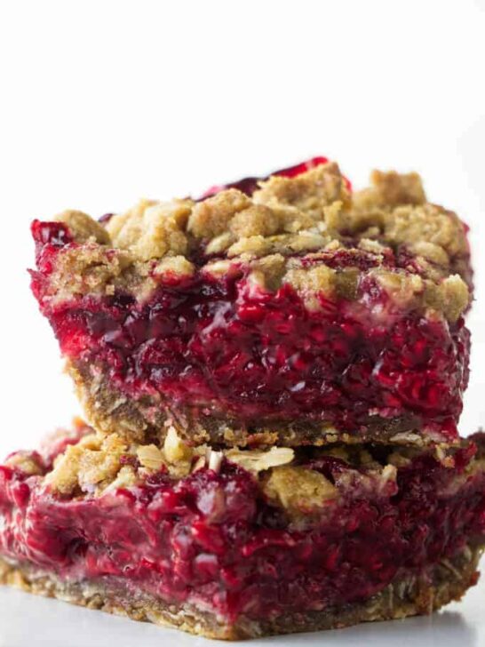 Two fresh raspberry bars stacked on each other.