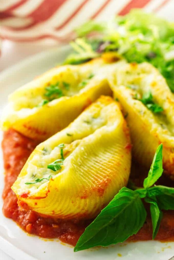 Close up view of 3 stuffed pasta shells