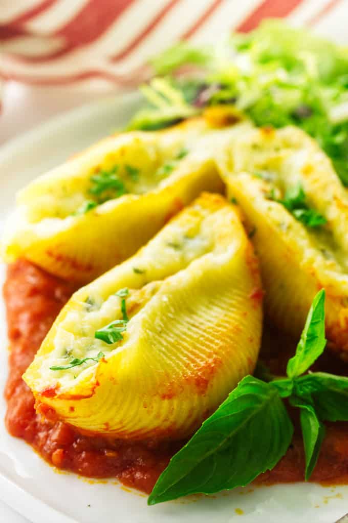 Close up view of 3 stuffed pasta shells