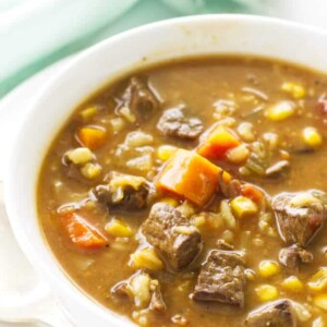 Overhead view of a bowl of beef barley soup