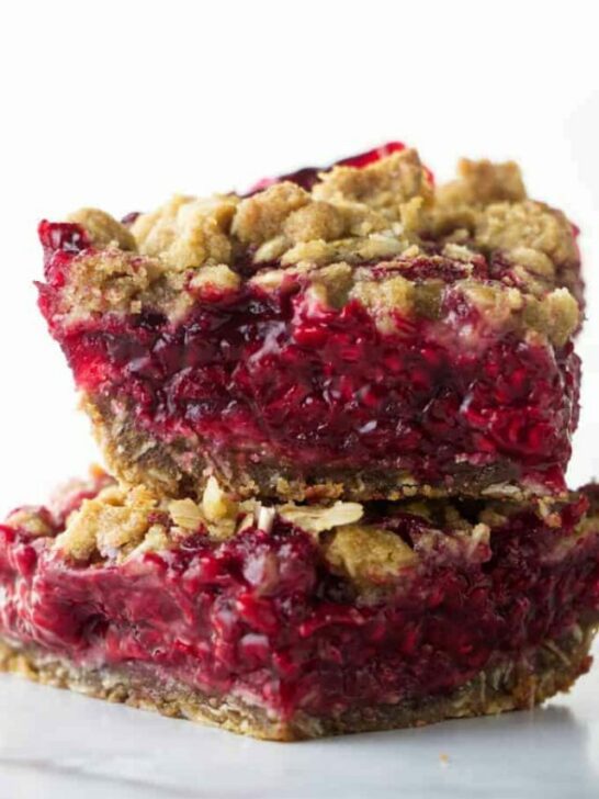 Two fresh raspberry bars stacked on each other.