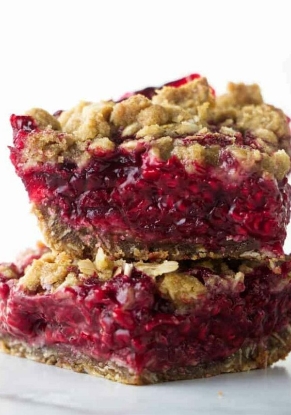 Two fresh raspberry bars stacked on each other.