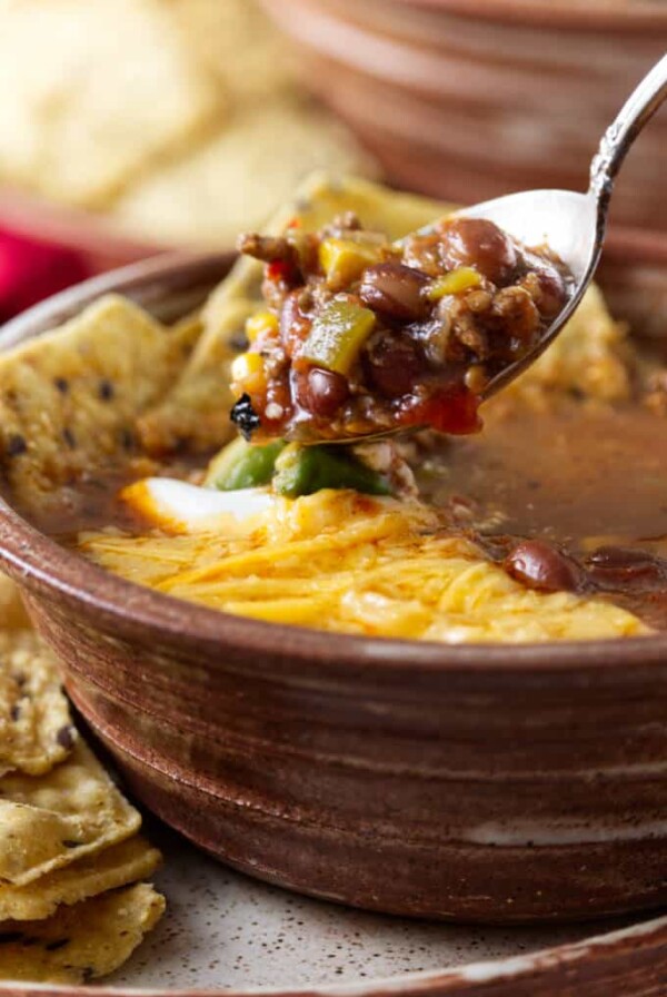 A spoon scooping some taco soup.