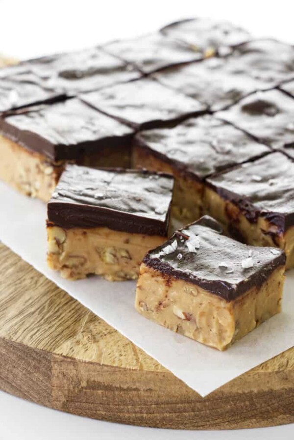 Several individual slices of brown sugar fudge with a layer of chocolate ganache on top.