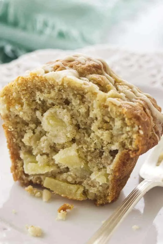 An apple ginger muffin cut in half.