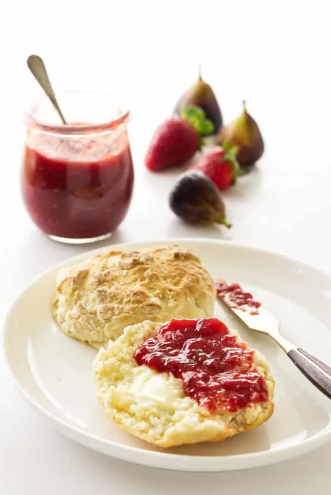 Strawberry fig jam spread on a biscuit.