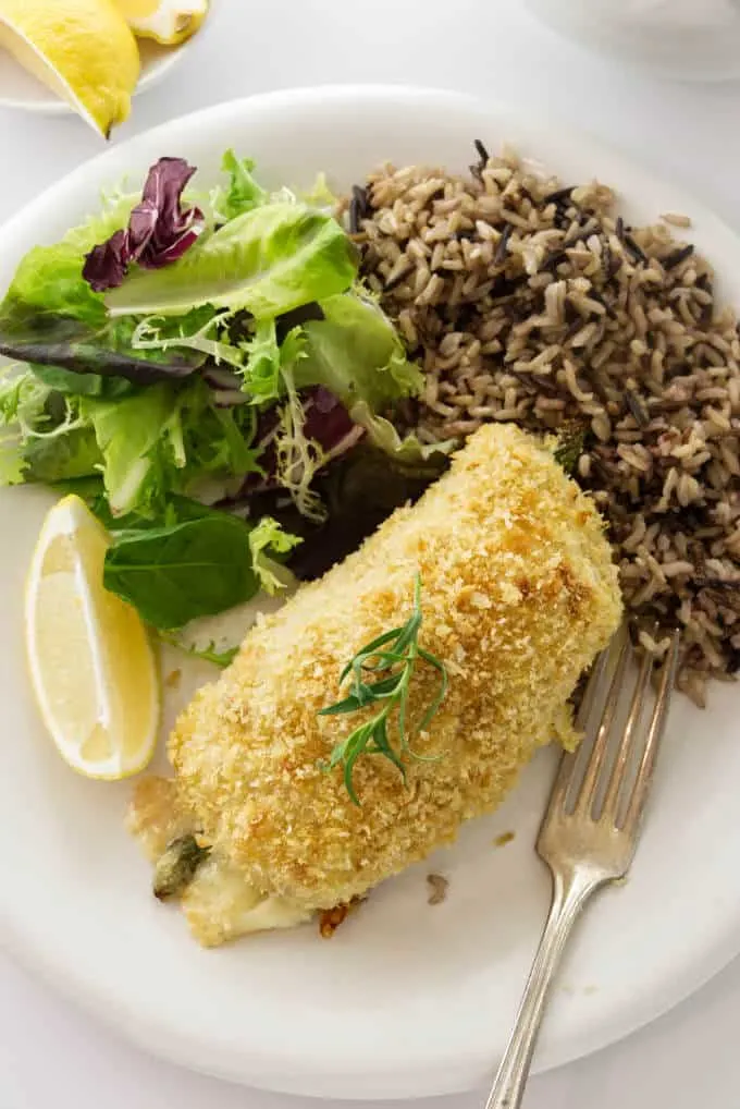 A chicken breast stuffed with cheese, ham and asparagus then rolled in breading.