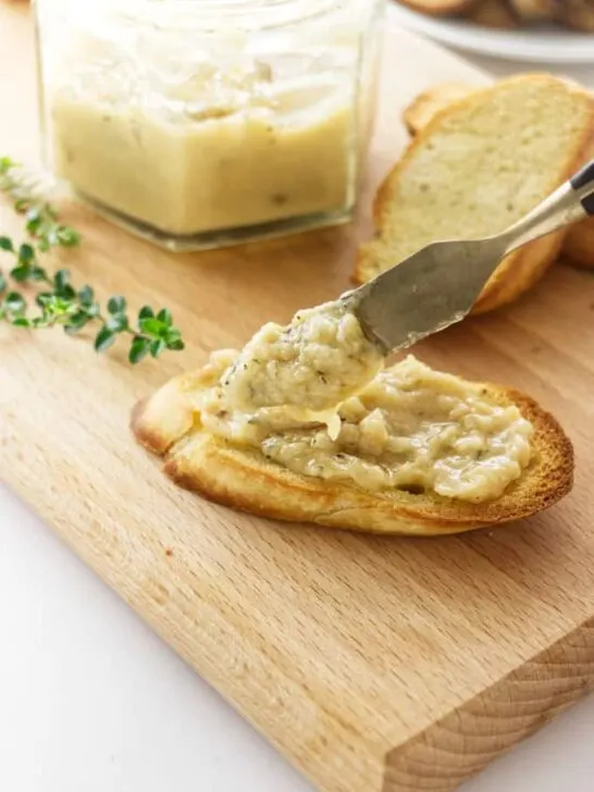 Roasted garlic spread on a piece of toast.