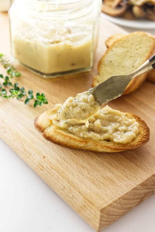 Roasted garlic spread on a piece of toast.