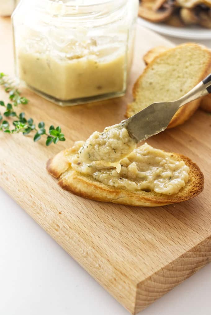 Roasted garlic spread on a piece of toast.