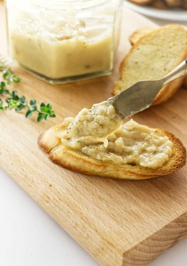 Roasted garlic spread on a piece of toast.