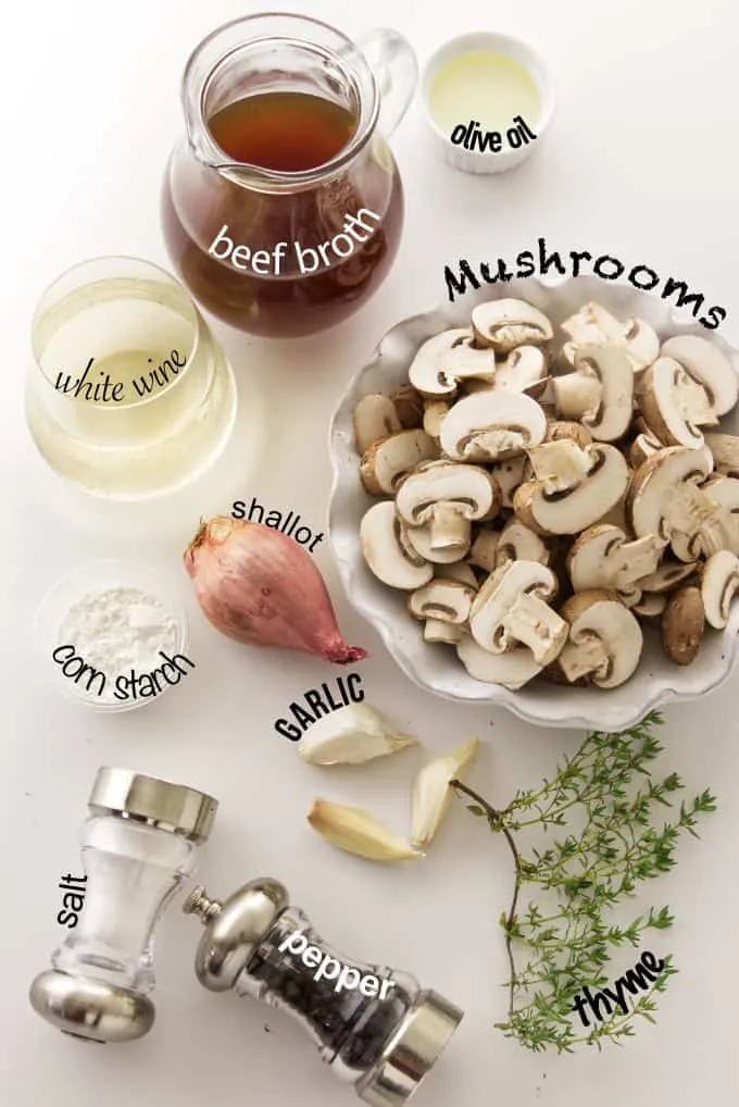 Ingredients needed for white wine mushroom sauce.