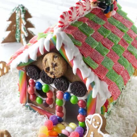View of roof and front of a decorated gingerbread house.
