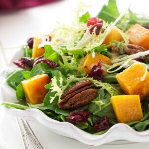 A serving plate with butternut squash salad.