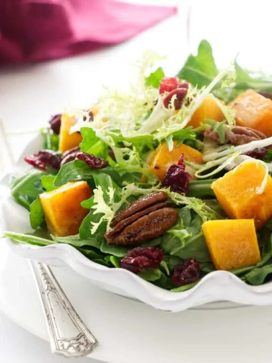 A serving plate with butternut squash salad.