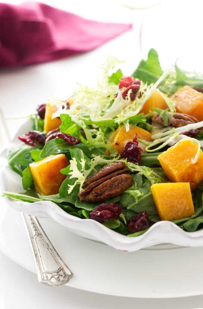 A serving plate with butternut squash salad.