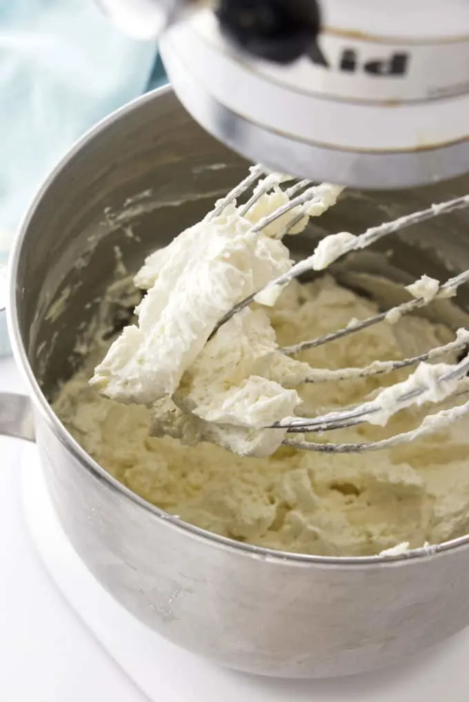 Fluffy frosting on mixer whisk