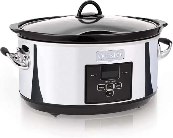 White and black slow cooker by Crock Pot.