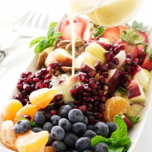 Winter fruit salad with lemon-honey vinaigrette pour