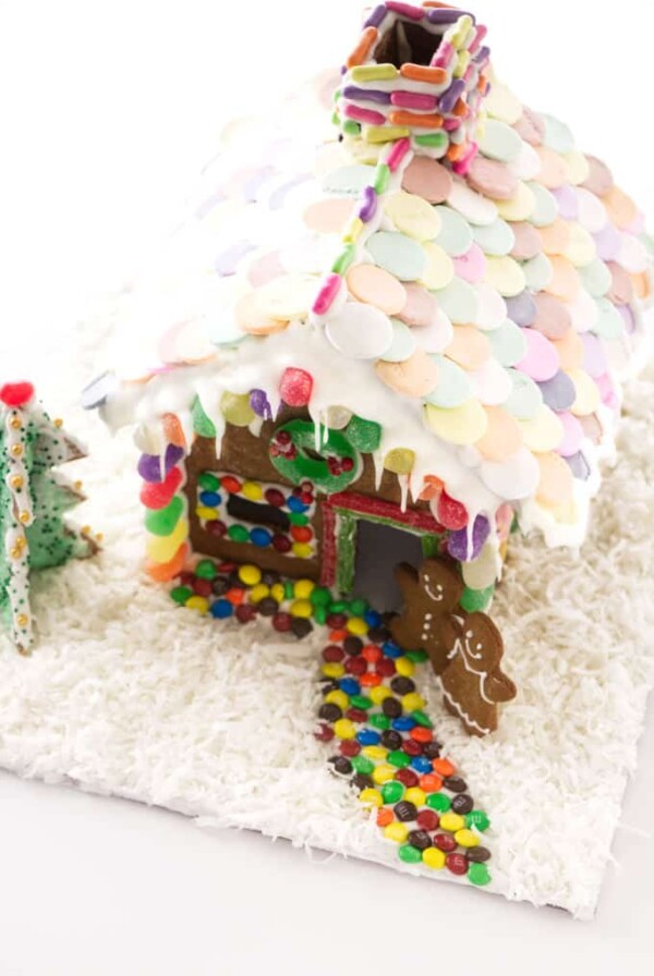 A decorated gingerbread house with a candy path to the door.