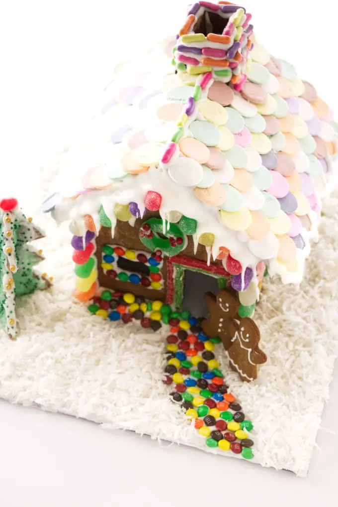 A decorated gingerbread house with a candy path to the door.