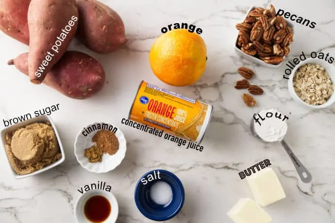 Ingredients used to make sweet potato casserole with pecan streusel and orange juice.