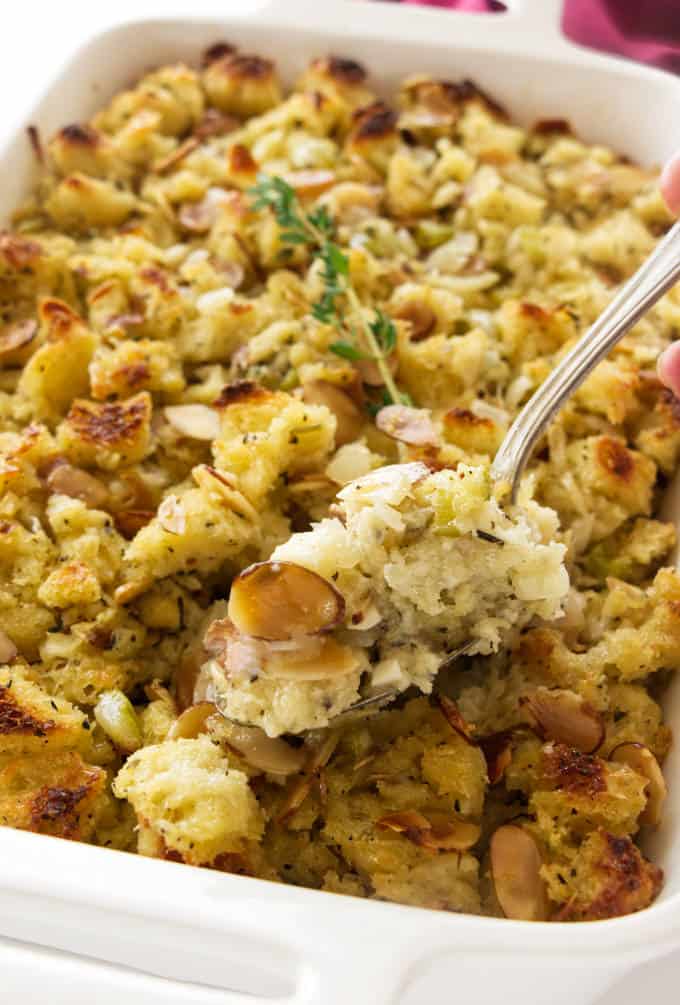 A spoon scooping out some sourdough stuffing.