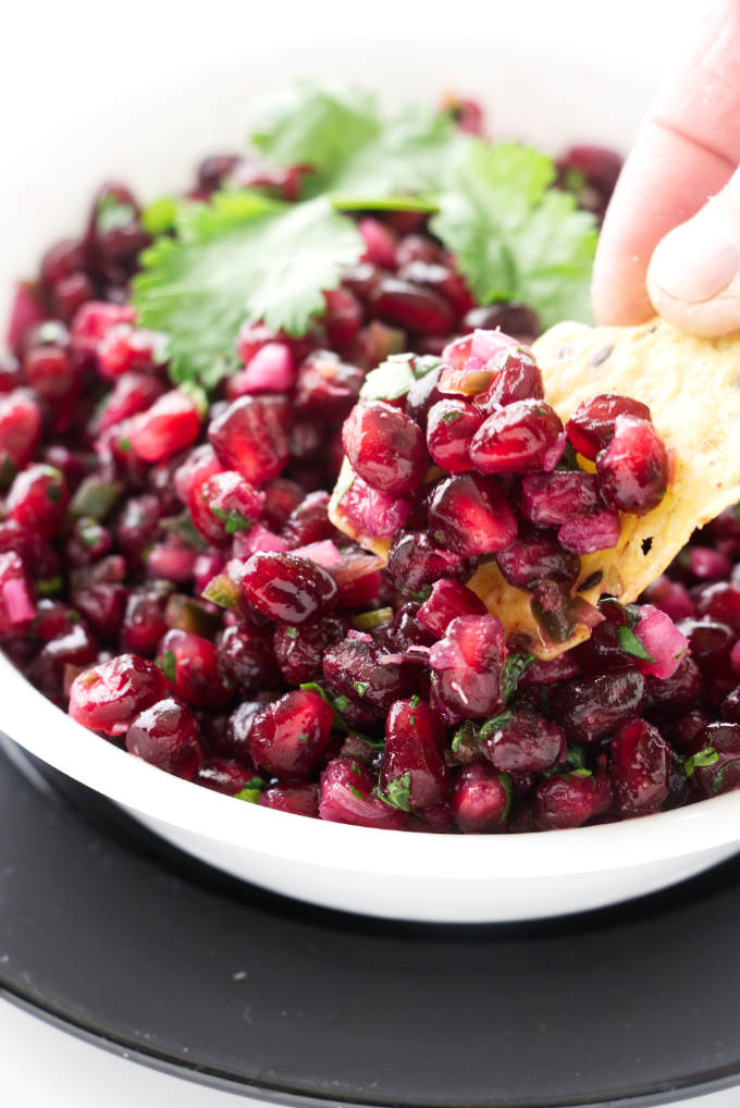 Pomegranate Salsa with a tortilla Chip dipping.