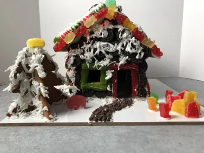 a gingerbread house decorated by readers Josh and Sara