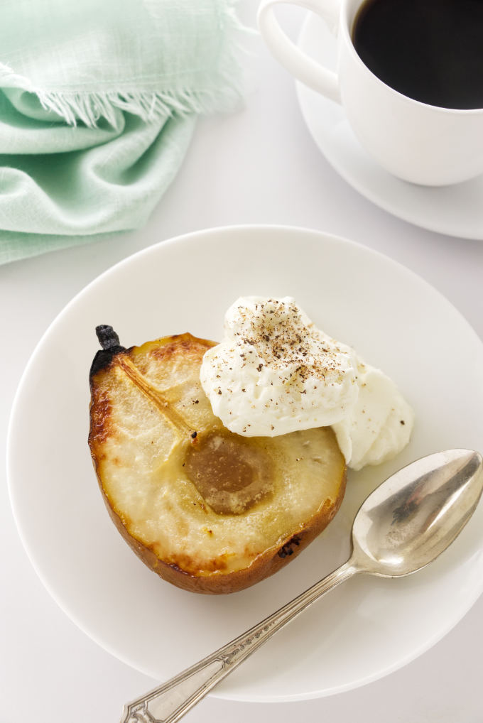 Overhead view of a serving of roasted pear with mascarpone cream