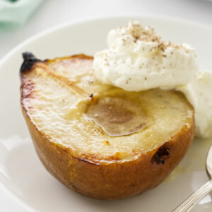 close up photo of a serving of roasted pear with mascarpone cream