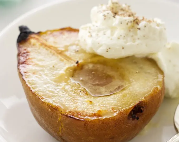 close up photo of a serving of roasted pear with mascarpone cream