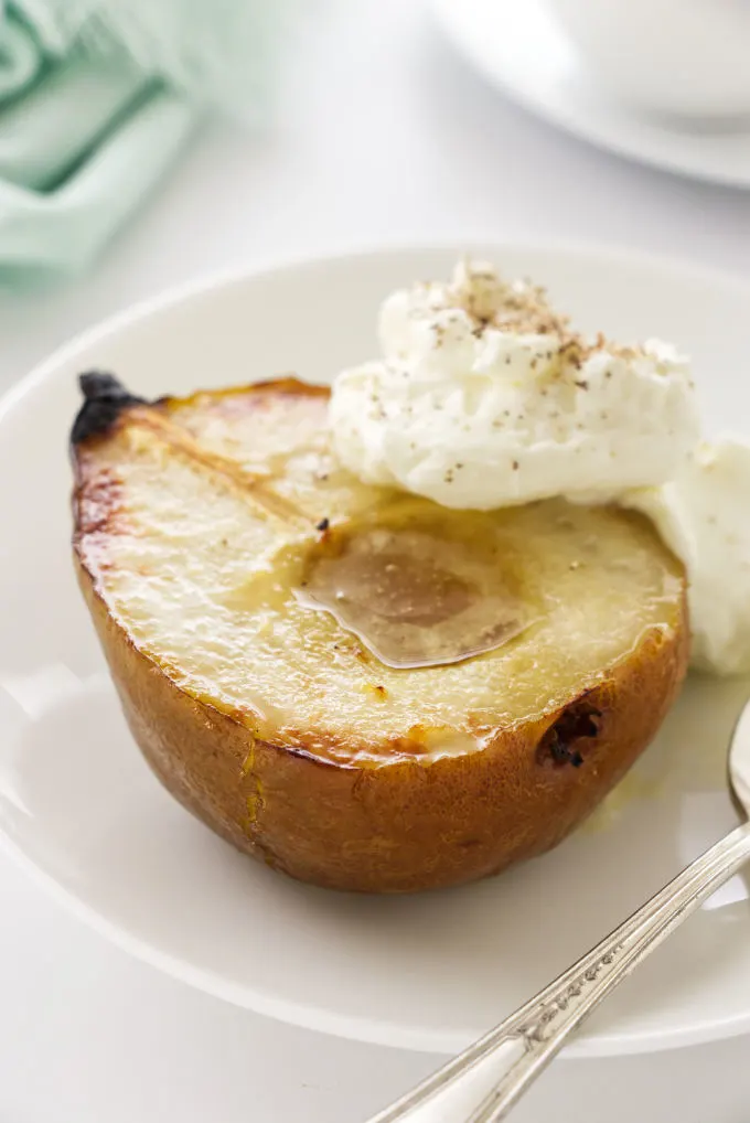 close up photo of a serving of roasted pear with mascarpone cream