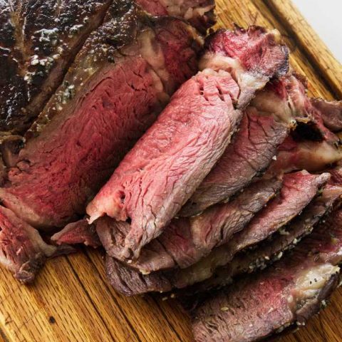 Close up view of cowboy steak on cutting board