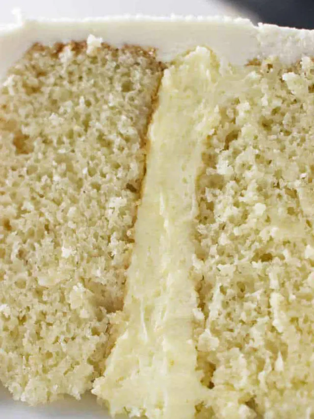 Vanilla cake filling between two layers of cake.