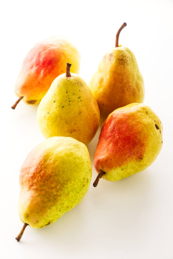Several fresh, ripe pears.