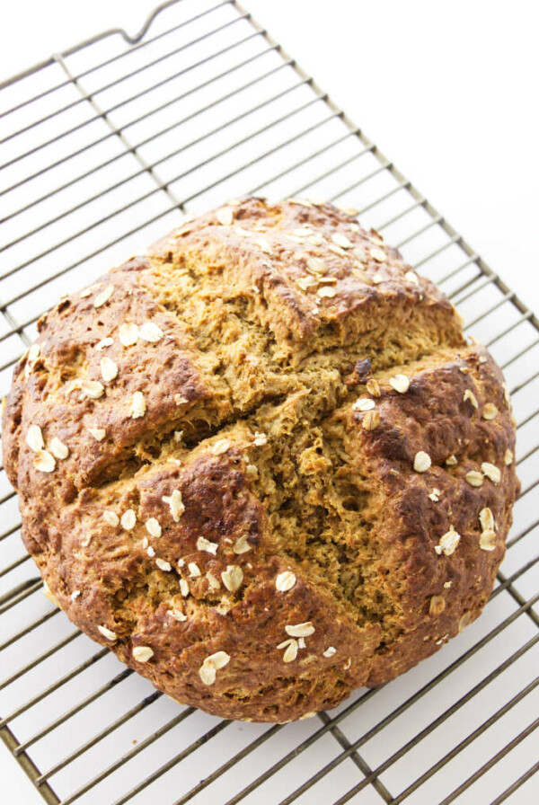 Overhead view of baked bread on cooling rack