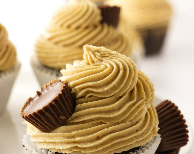 A chocolate cupcake with peanut butter frosting.