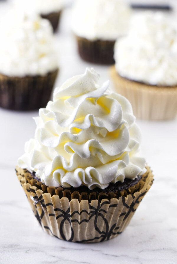 Italian meringue buttercream piped on a cupcake.