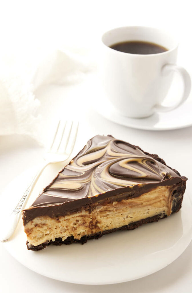 A slice of chocolate peanut butter tart with coffee.