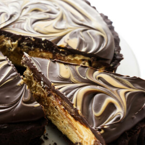 Chocolate peanut butter tart with chocolate ganache on top.