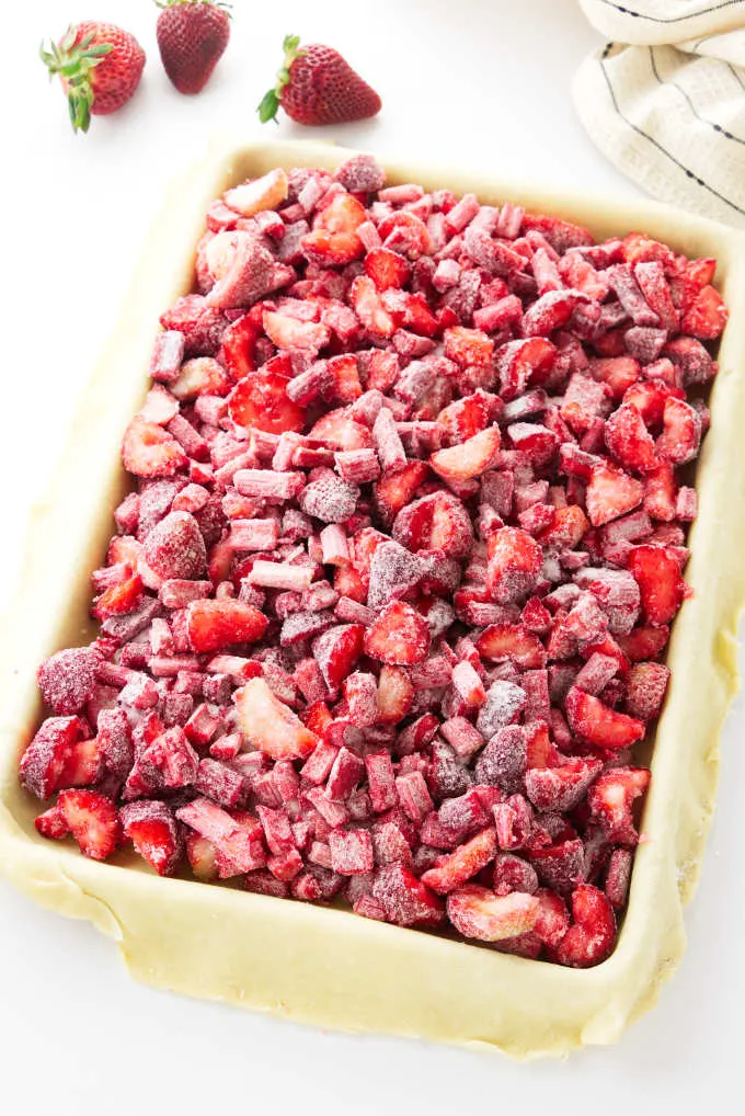 Quarter-size sheet pan with pastry crust and strawberry-rhubarb filling